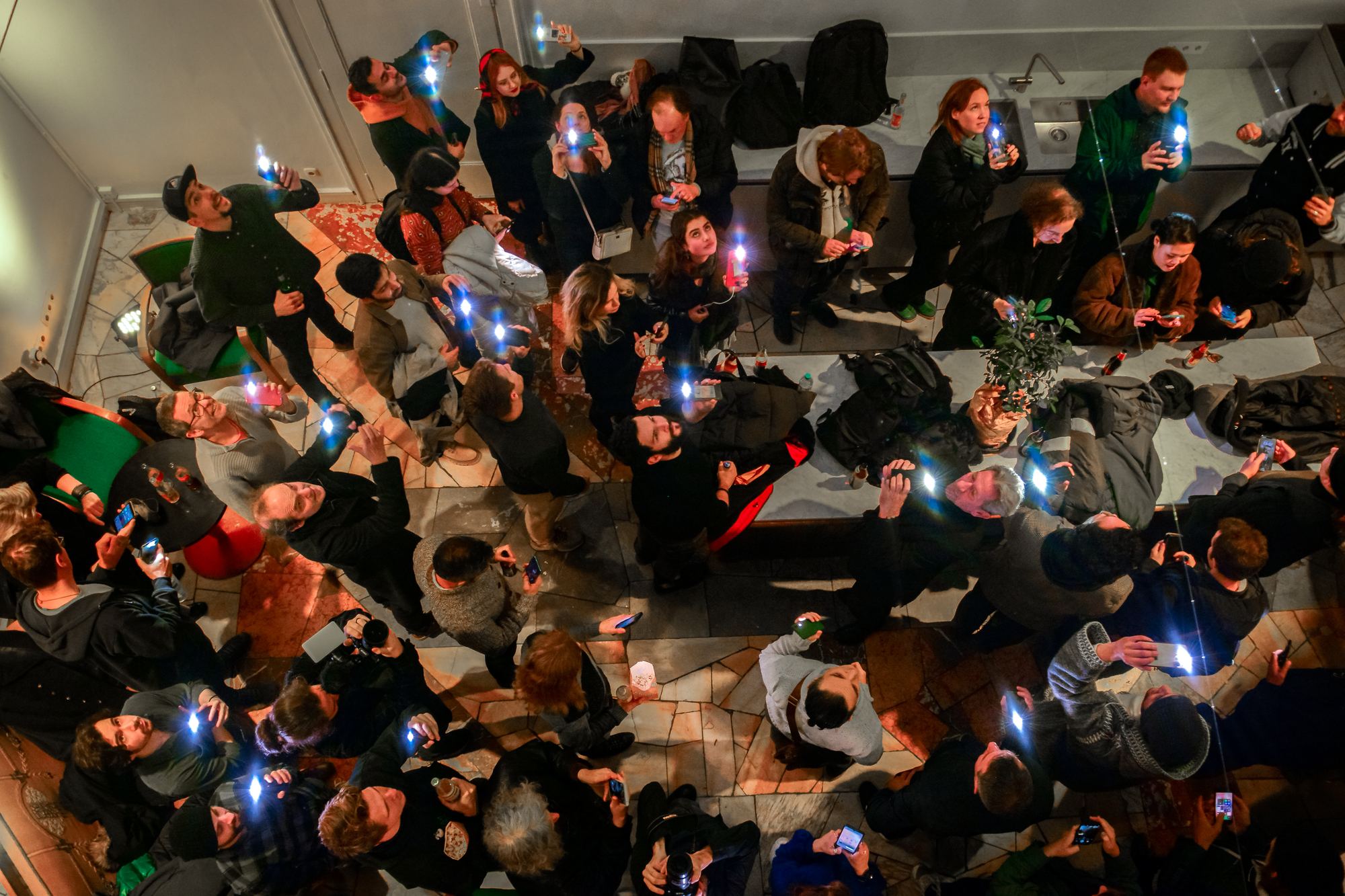A crowded room of people at a Movie Sprint event, seen from above